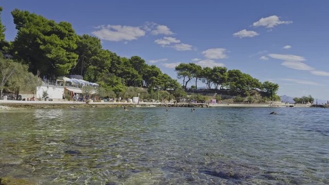 A wide shot of people at Bacvice Beach, Split, Croatia