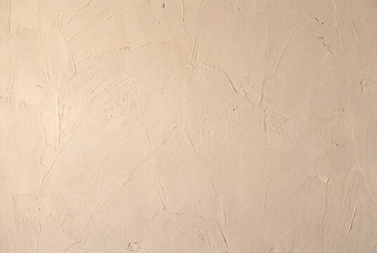Rough beige plaster surface texture