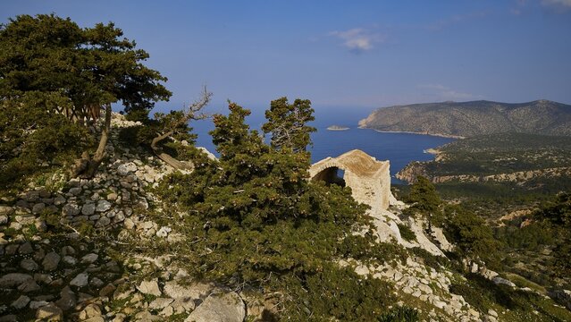 Fascinating view of the coast with mountains, sea and ruins, surrounded by trees and sky, Kastro Monolithou, Monolithos Castle, rock castle, Monolithos village, Rhodes, Dodecanese, Greek Islands, Greece