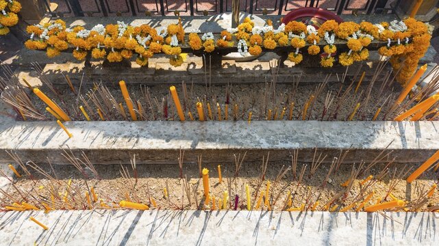 Incense and candles in a temple, Bangkok, Thailand
