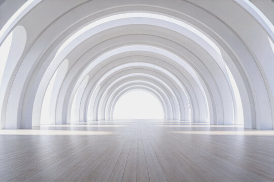 A long, empty minimalist arched corridor with repetitive white arches and smooth light-colored flooring, creating a sense of depth and symmetry.