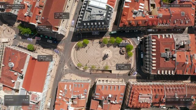 Top down aerial view of Lisbon: cars around Camoes Square, its monument and red roofs with white glass interface overlay, tracking frames and data chips. Concept of smart city, traffic monitoring