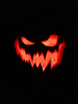 halloween pumpkin red light on black