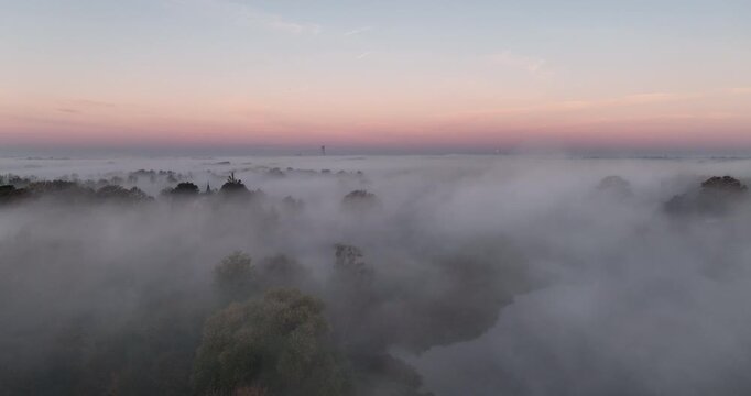 Aerial flight over sea of fog at sunrise near Trestno Lower Silesia