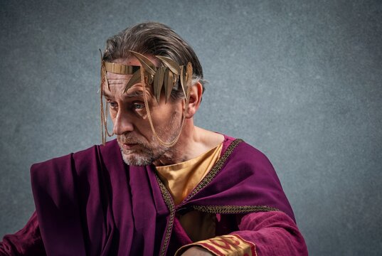 Portrait of a costumed man portraying an ancient religious ceremonial figure