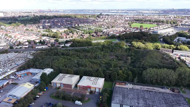 Aerial drone 4K view of Birkenhead Park pathways and surrounding housing glowing in warm afternoon light Birkenhead Park UK