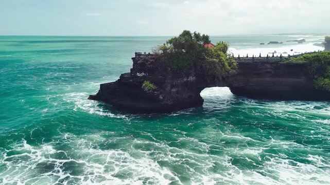 Aerial drone view of Tanah Lot temple and Pura Batu Bolong