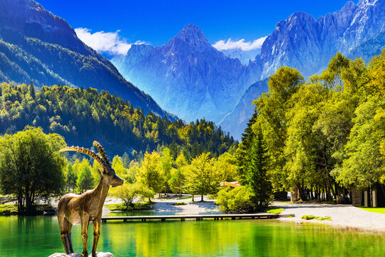 Statue of Kozorog goat on beautiful Lake Jasna in Kranjska Gora, Alps, Slovenia