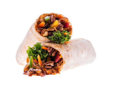 Cut vegetarian burrito with vegetables and lettuce on a white background