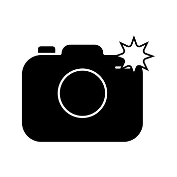 A black silhouette icon of a digital camera with a flash burst effect, representing photography and image capture isolated on transparent background