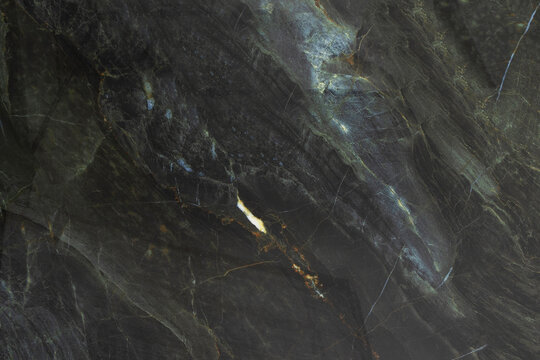 Dark ceramic tile with marble veins. Stone texture background. Interior design material. Abstract surface for bathroom or kitchen. Background for designers