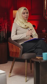 Arab woman psychologist giving advice to patient during therapy session