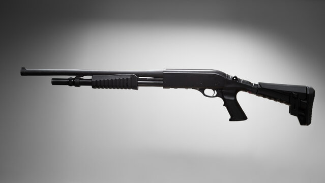 Black tactical pump action shotgun 12 gauge with pistol grip on gray gradient background