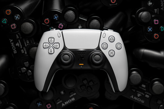 October 6, 2026, Odessa, Ukraine.  White Sony DualSense controller on retro gamepads