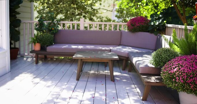 Stylish Outdoor Living Space with Sectional Sofa on Shaded Backyard Deck