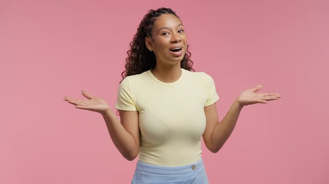 Surprised teenage Girl Making Mind Blown Gesture On pink Background. Expresses Wow, incredible news, breakthrough ideas,exciting discoveries