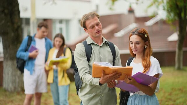 University students discussing homework together on campus