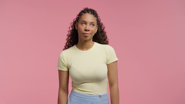 Bored Upset African Teen Girl Sighs, Rolling Eyes On Pink. Offended Lady, Come On. Pretty model in displeasure, she is tired of situation