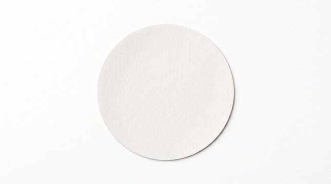 Blank white circular paper coaster isolated on white background