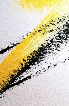Vibrant yellow and black textured brush strokes on rough white paper creating dynamic abstract art with high contrast and energetic movement
