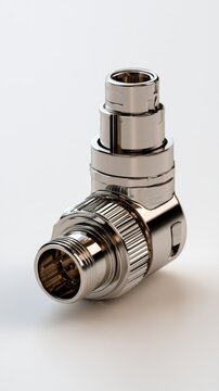 Durable metallic right-angle connector adapter with threaded coupling and precise engineering for electronic and industrial applications on white background