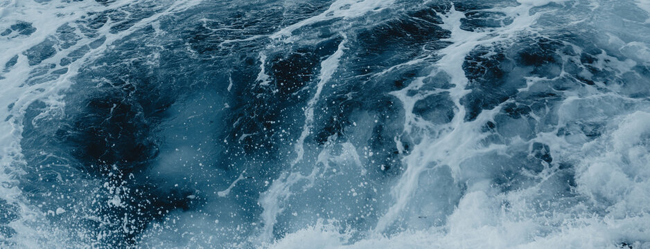 Swirling Ocean Foam and Deep Blue Water Abstract Texture
