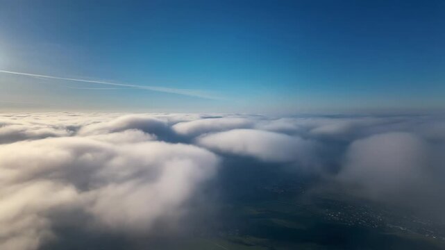 Realistic Aerial View of a Vast Sea of White Fluffy Clouds Under a Clear Blue Sky