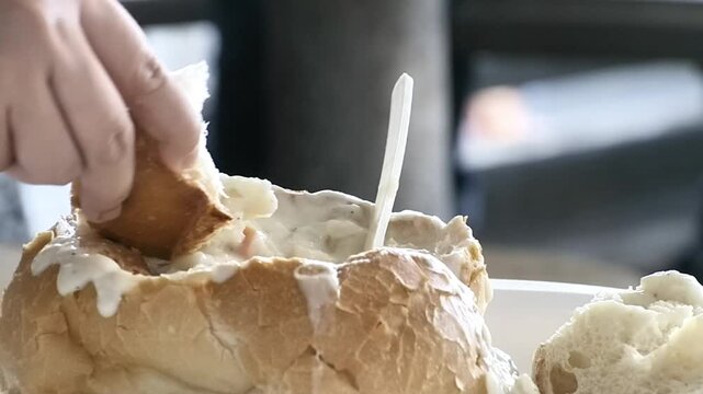 Creamy Seafood Chowder Served Inside Sourdough Bread
