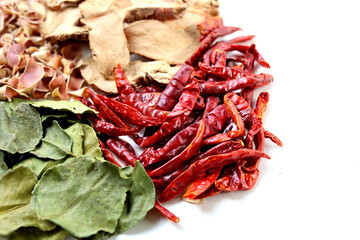 Fototapeta premium Collection of dried Tom Yum herbs including galangal, lemongrass, chili, and kaffir lime leaves. Traditional Thai food ingredients