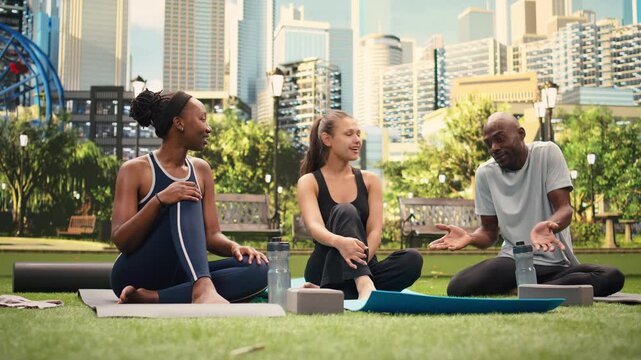 Yoga friends posing for smartphone selfies resting on yoga mats