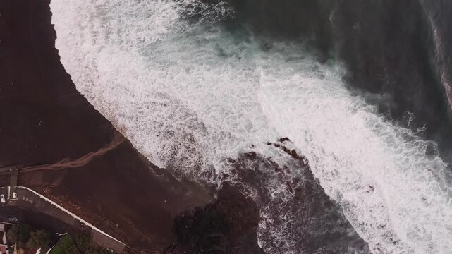 Drone shot, from above, surf at the beach of Praia dos Mosteiros, Mosteiros, Sao Miguel Island, Azores, Atlantic Ocean, Portugal