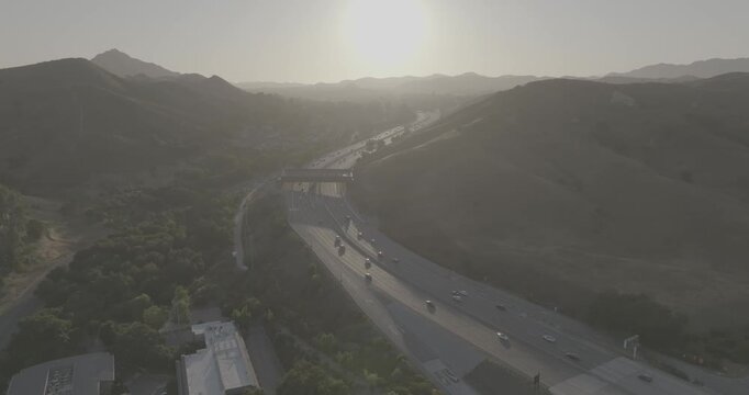 Aerial Push-In Toward Wildlife Crossing Over Freeway