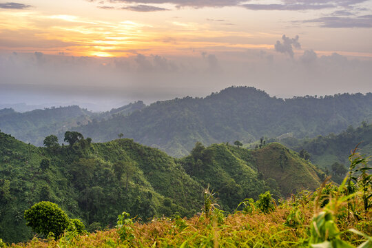 View of Thanchi hills at sunset with lush green vegetation and rolling mountains in Bandarban, Chittagong Division, Bangladesh.