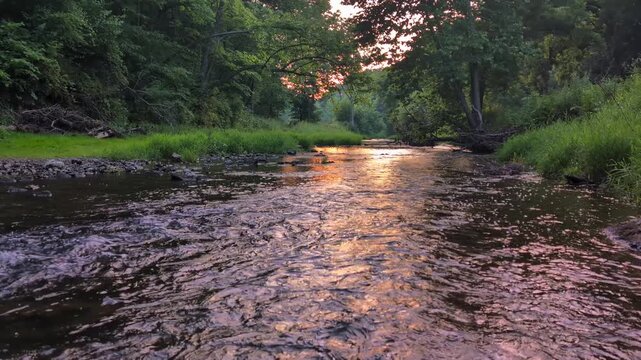 Sunset reflects off riffles of the Apple River in northern Illinois