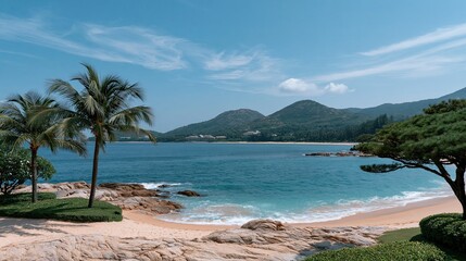 Fototapeta premium Tropical beach with coconut palm trees, turquoise sea waves, blue sky and distant mountains, summer vacation landscape