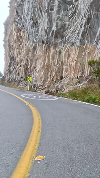 Scenic Mountain Road through High Altitude Landscape. Driving POV. Vertical Video.
