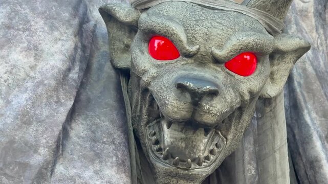 Scary Gray Gargoyle Halloween Decoration with Glowing Red Eyes and Open Fanged Mouth Close-Up