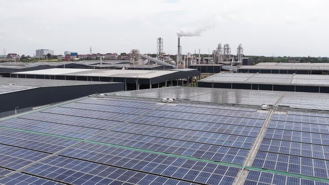Large scale solar photovoltaic panel array on industrial factory roof