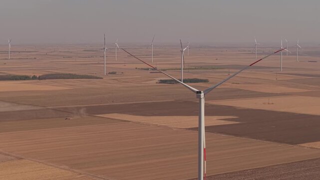 Turning Wind Turbine Rotor Against a Distant Rural Wind Farm