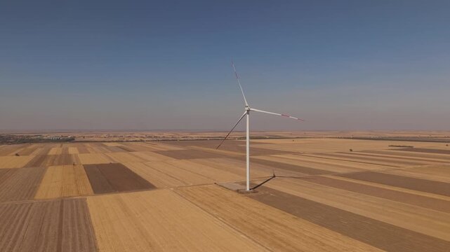 Single Wind Turbine and Its Shadow Over Harvested Field Strips