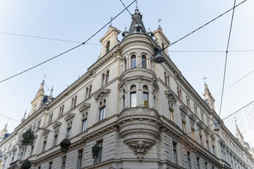 Ornate historic building facade with overhead wires © iBennn