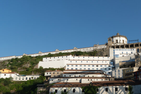 Historic hilltop monastery complex above a village