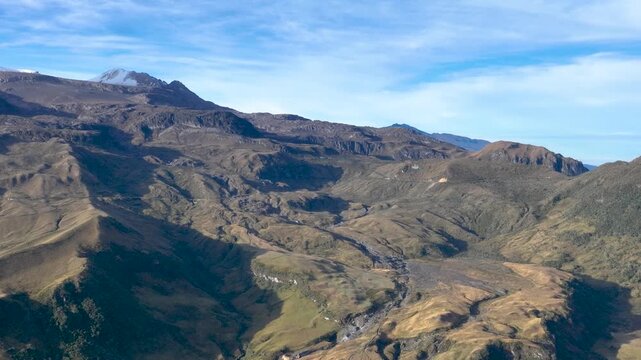 Nevado del Ruiz Snow Covered Volcano in the Colombian Andes. Establishing Shot. Aerial View.