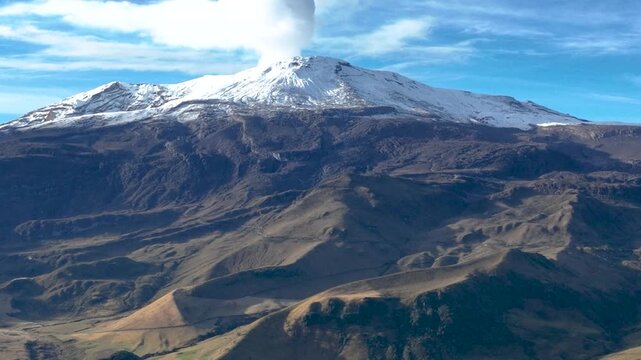 Nevado del Ruiz Snow Covered Volcano in the Colombian Andes. Establishing Shot. Aerial View.