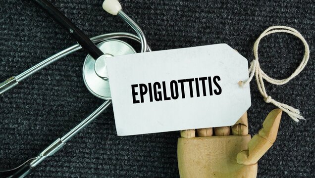 Stethoscope and paper tag with the word Epiglottitis is a life-threatening medical emergency where the epiglottis&mdash;the small cartilage flap that covers your windpipe when you swallow&mdash;swells rapidly 