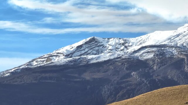 Nevado del Ruiz Volcano Covered with Snow above the Andean Highlands in Colombia. Aerial View.