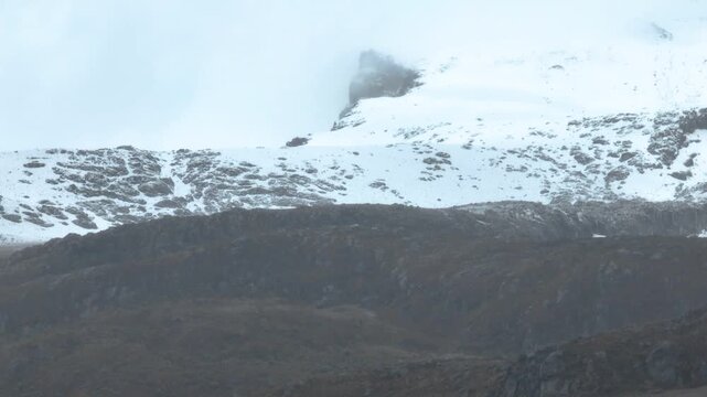 Nevado del Ruiz Snow Covered Volcanic Slopes in the Colombian Andes. Establishing Shot. Aerial View.