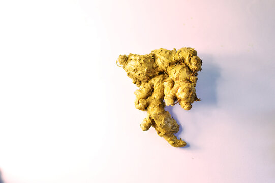 Fresh organic ginger root isolated on white background close up