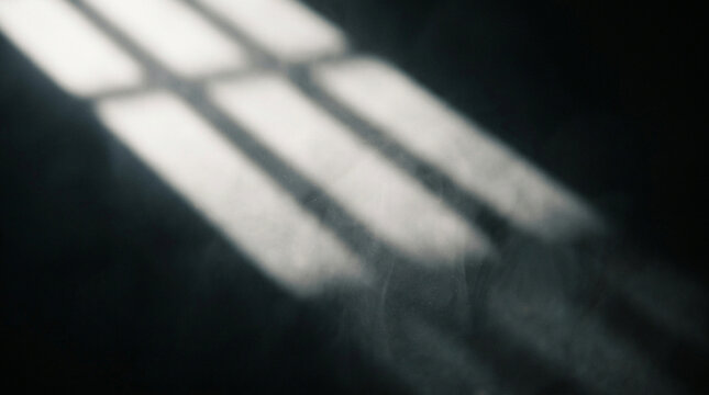 Light beams falling diagonally through dark dusty atmosphere, dramatic window sunlight ray effect overlay for moody photography and creative design