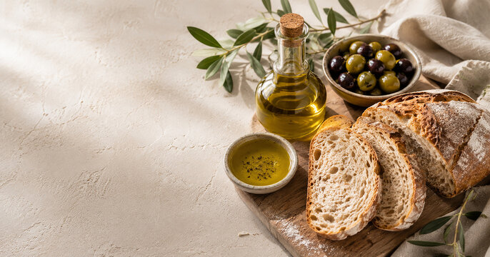 Artisanal Sliced Fresh Sourdough Bread Served With Extra Virgin Olive Oil And Mixed Olives
